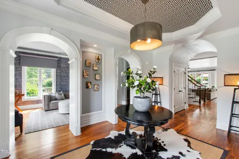 a dining room with furniture and chandelier