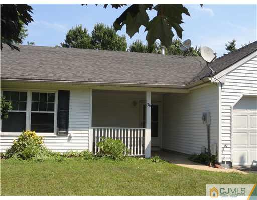 36 Woodbury Road Edison, NJ 08820 - Photo 2 of 15 a front view of a house with a garden