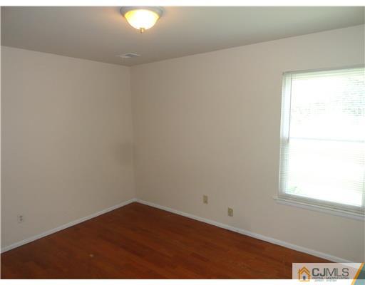 36 Woodbury Road Edison, NJ 08820 - Photo 12 of 15 an empty room with a window