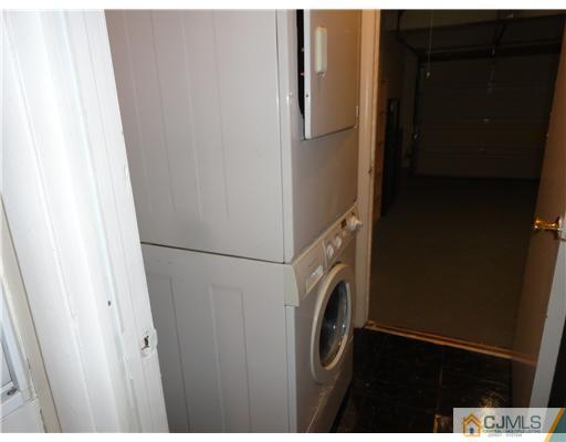 36 Woodbury Road Edison, NJ 08820 - Photo 8 of 15 a utility room with dryer and washer