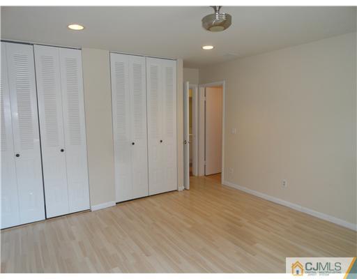 36 Woodbury Road Edison, NJ 08820 - Photo 9 of 15 a view of an empty room with wooden floor