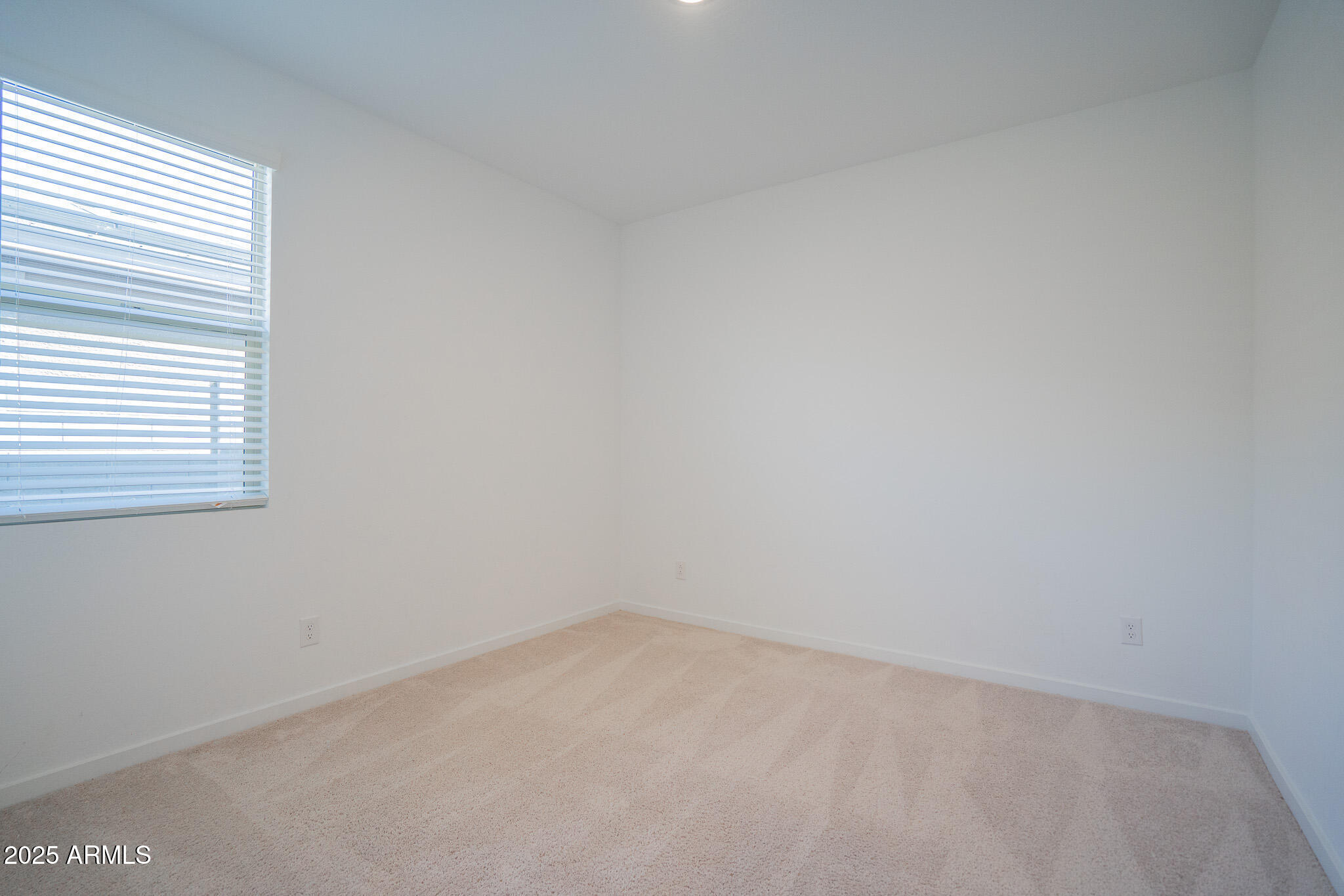 17317 West Running Deer Trail Surprise, AZ 85387 - Photo 11 of 37 an empty room with a window