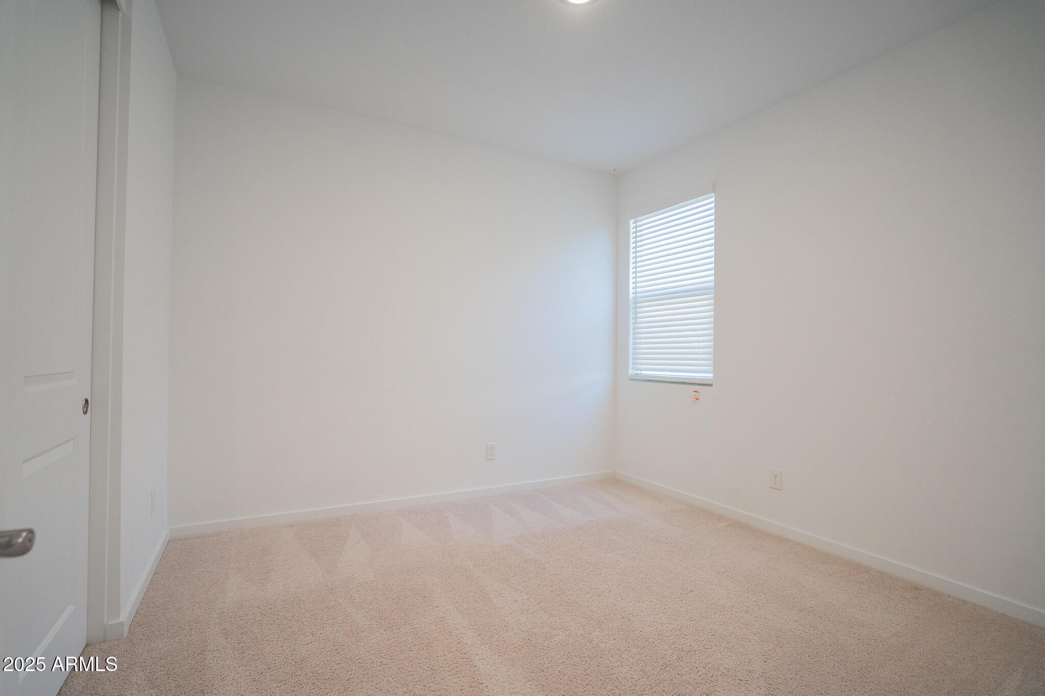 17317 West Running Deer Trail Surprise, AZ 85387 - Photo 13 of 37 an empty room with a window
