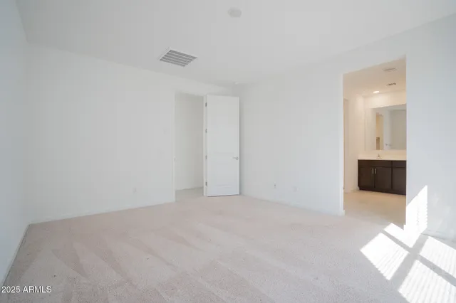 a bathroom with a shower and a sink