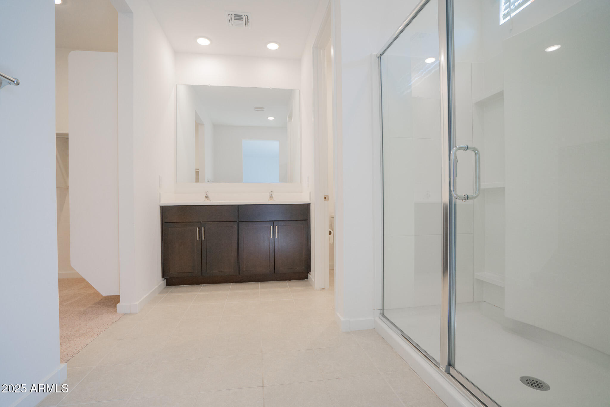 17317 West Running Deer Trail Surprise, AZ 85387 - Photo 18 of 37 a bathroom with a shower and a sink