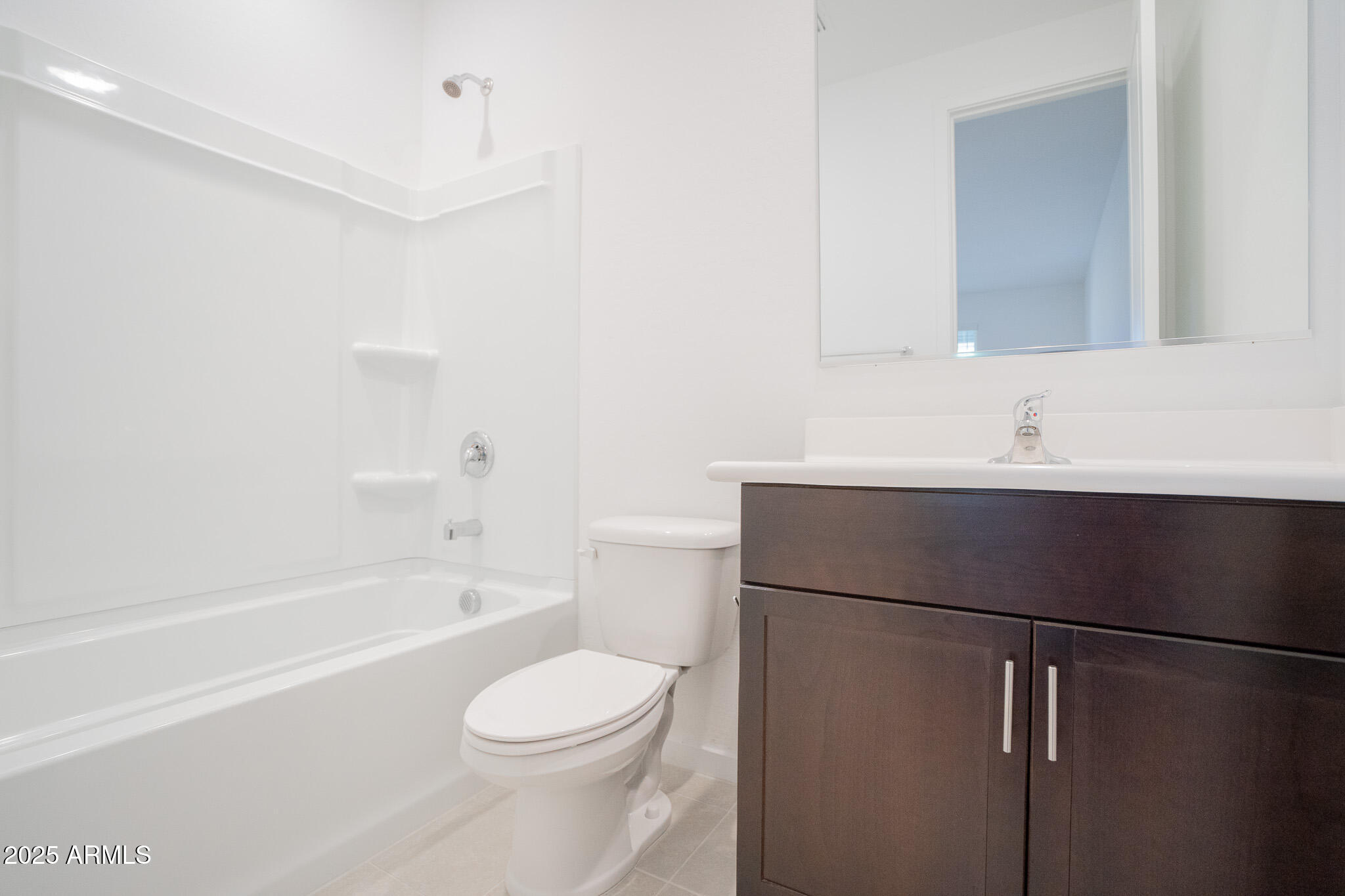 17317 West Running Deer Trail Surprise, AZ 85387 - Photo 25 of 37 a bathroom with a sink a toilet and shower