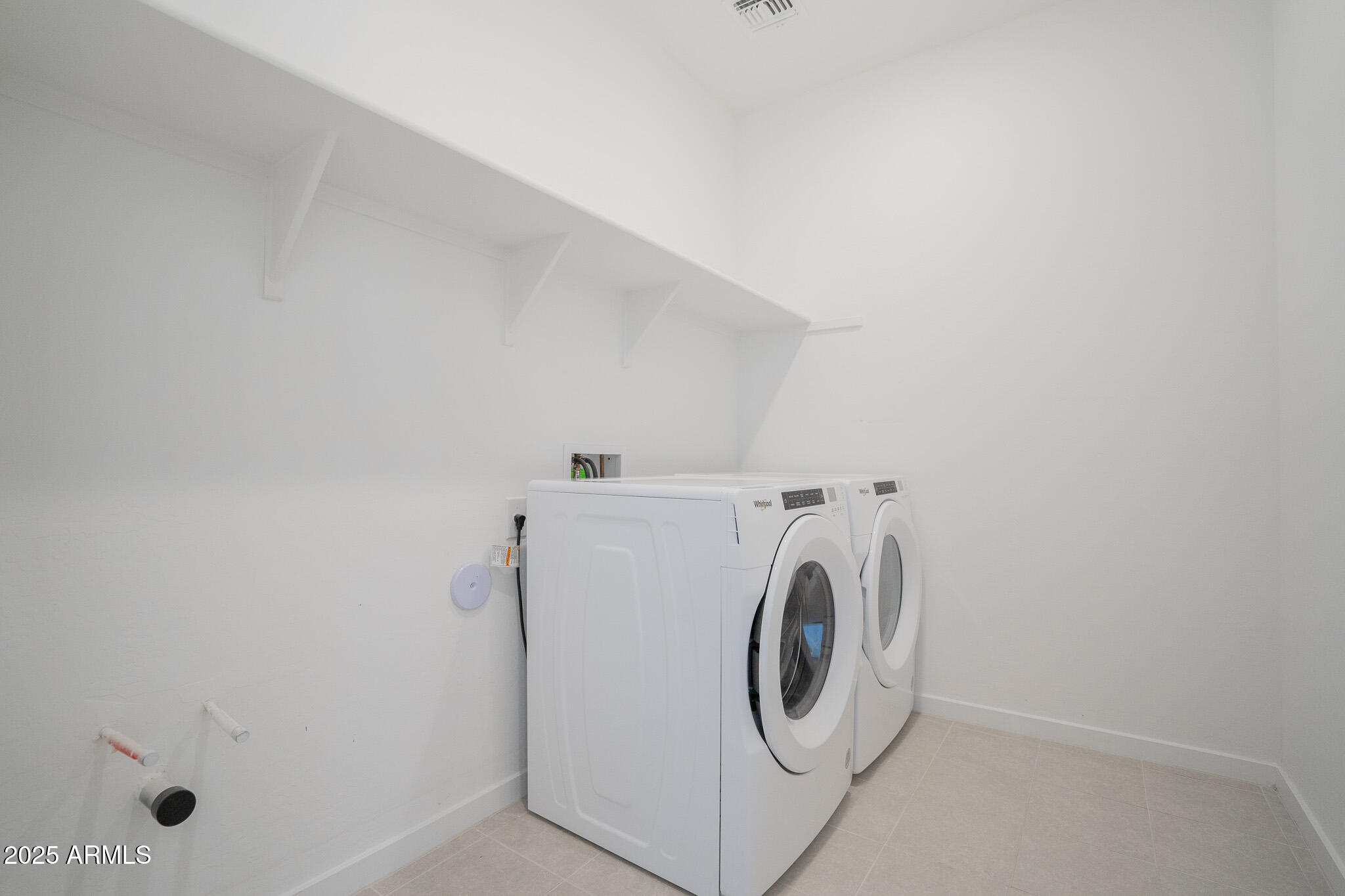 17317 West Running Deer Trail Surprise, AZ 85387 - Photo 27 of 37 a utility room with dryer and washer