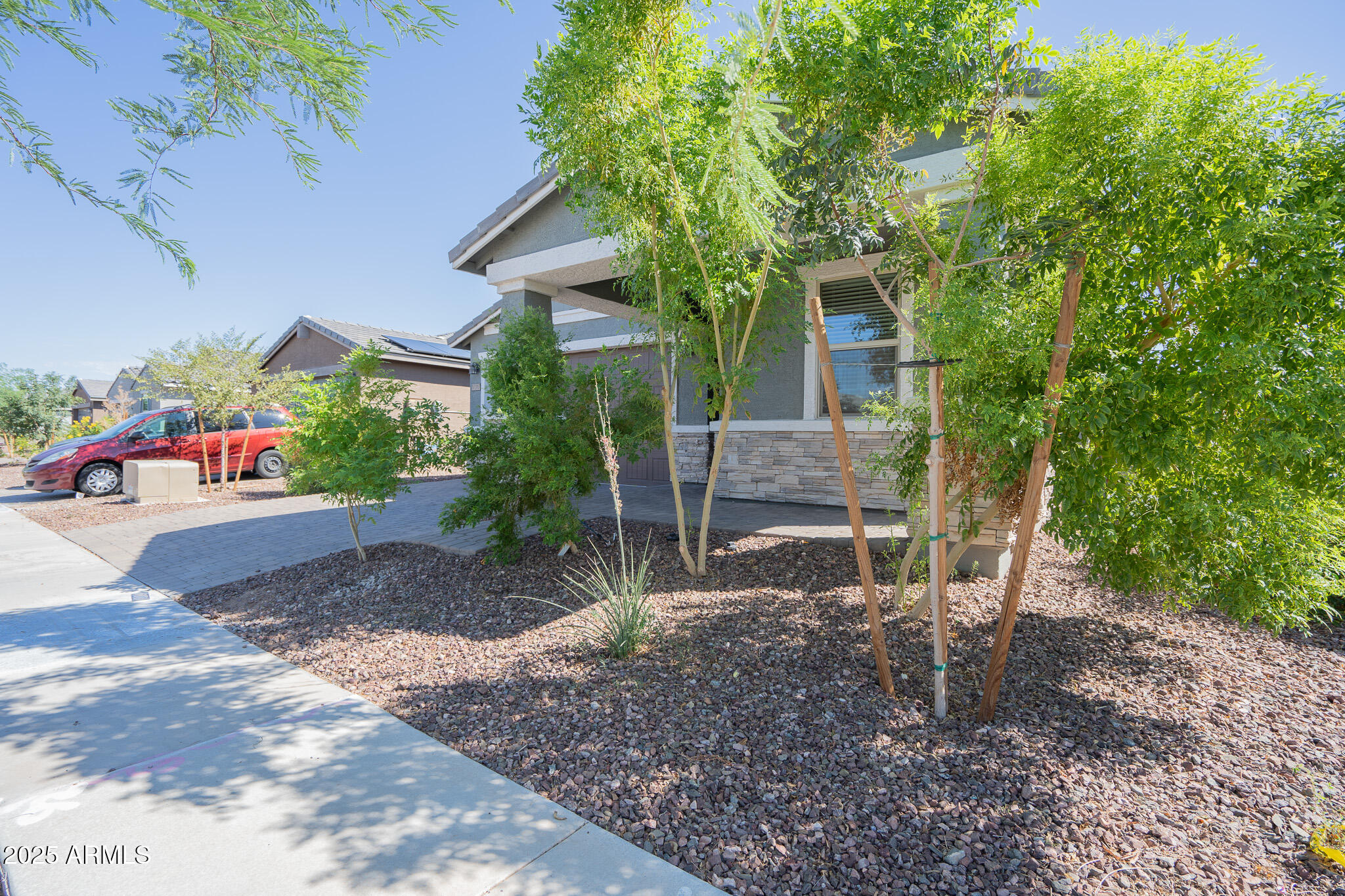 17317 West Running Deer Trail Surprise, AZ 85387 - Photo 3 of 37 a backyard of a house with table and chairs