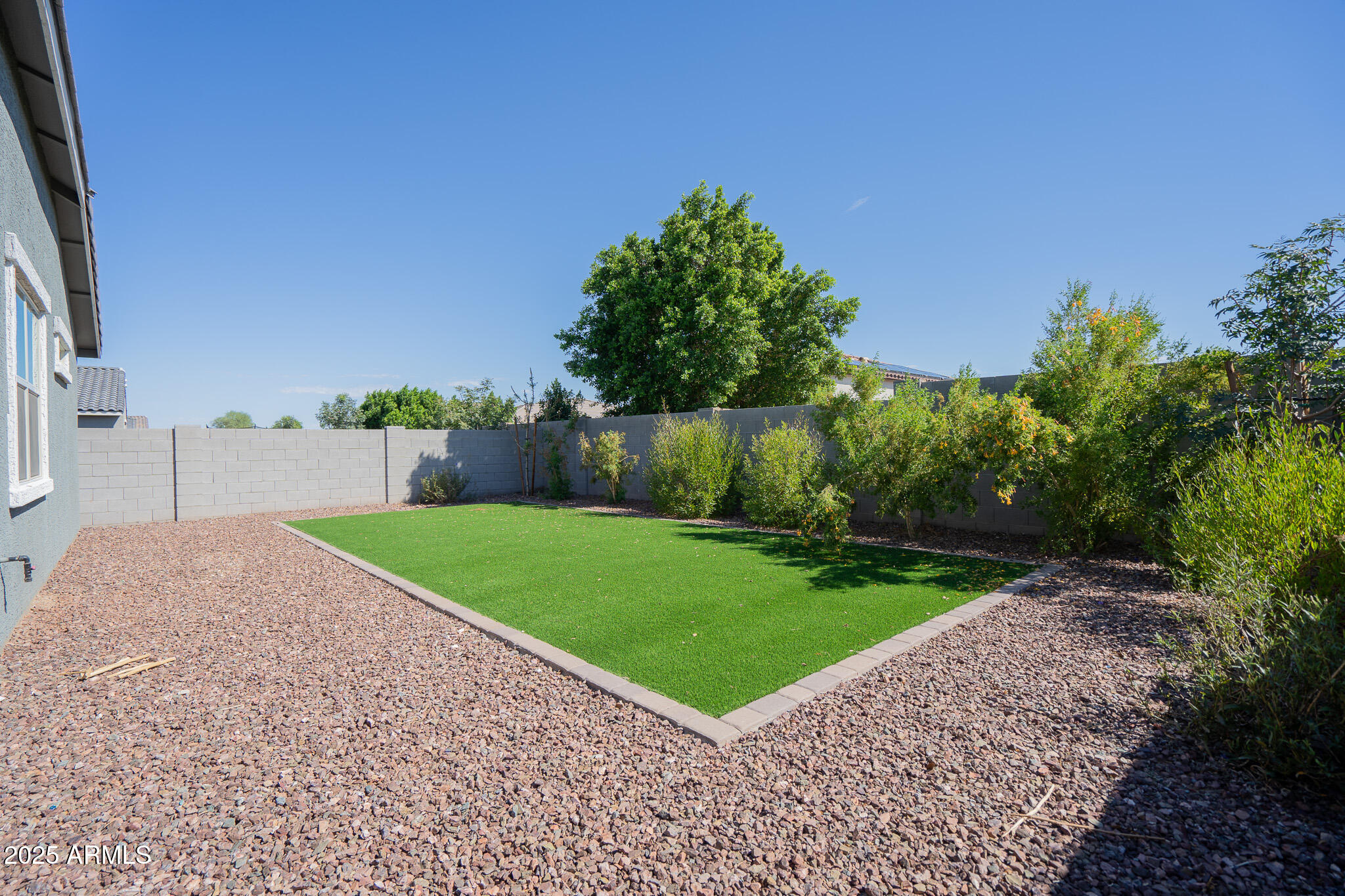 17317 West Running Deer Trail Surprise, AZ 85387 - Photo 34 of 37 a green field with some trees in the background