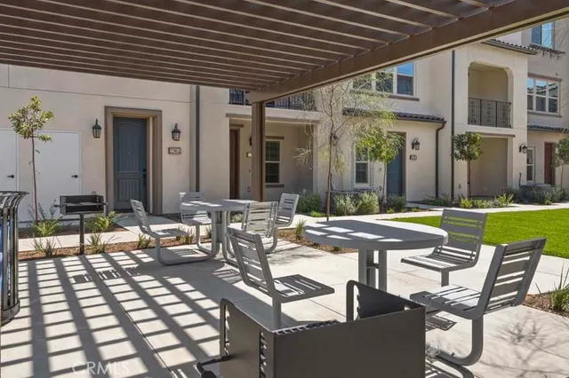 a view of a house with sitting area and furniture