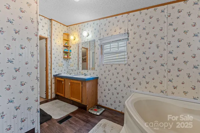 a bathroom with a bathtub and shower