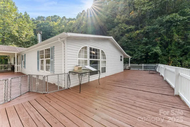 a view of a house with pool and wooden floor