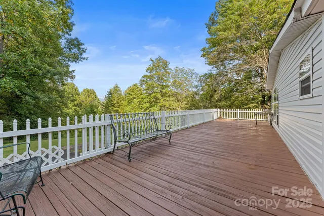 a view of deck with wooden floor and outdoor seating