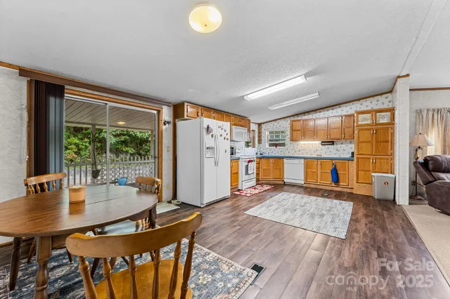 a dining room with furniture and wooden floor