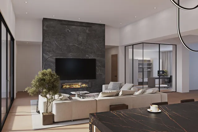 a living room with furniture and a fireplace