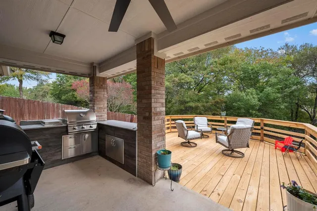 a kitchen view with a stove and wooden cabinets