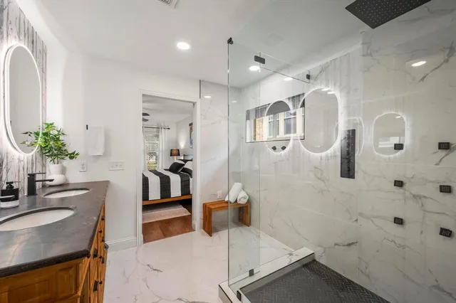 a bed room with a bed furniture and a tv