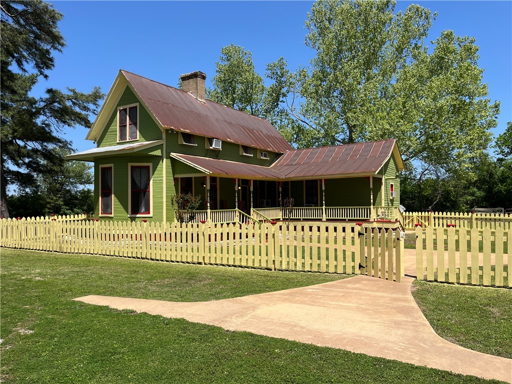 Charming 1860's farm house front view, with covere