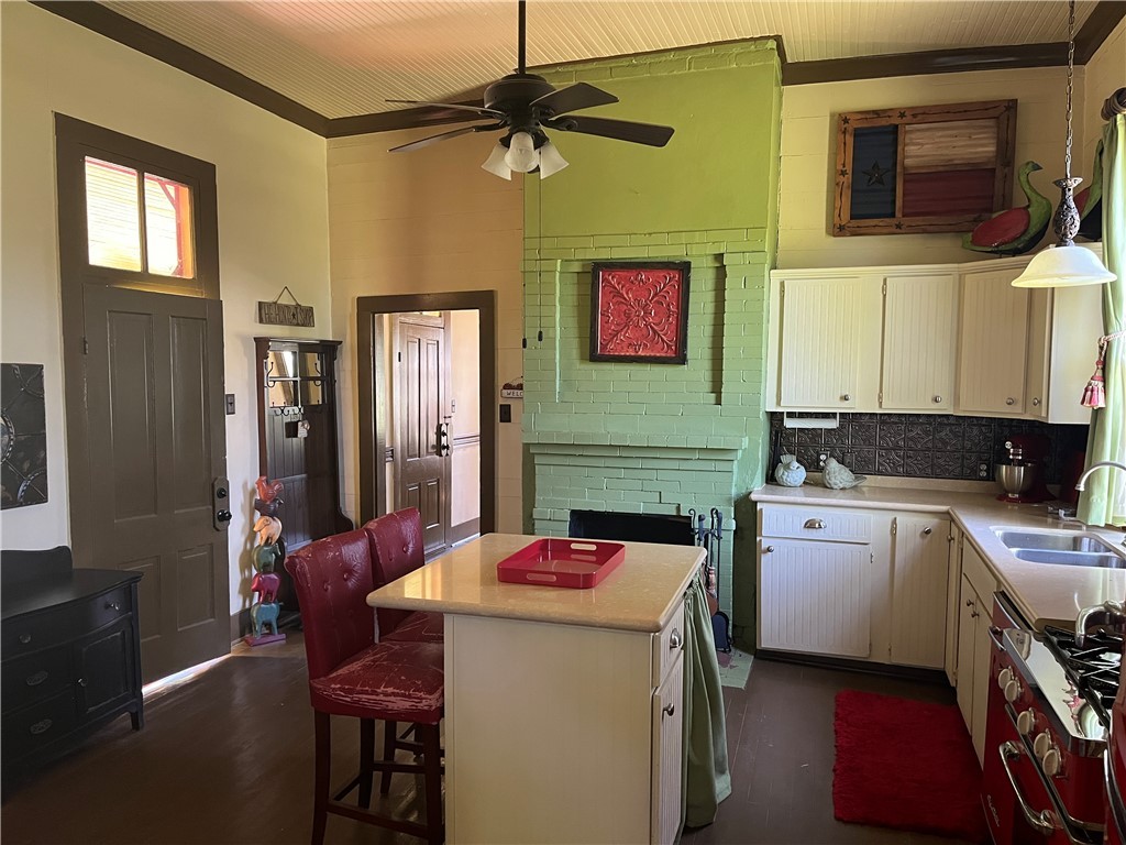 1100 Maple Calvert, TX 77837 - Photo 20 of 31 Kitchen center island, a sink, light countertops,