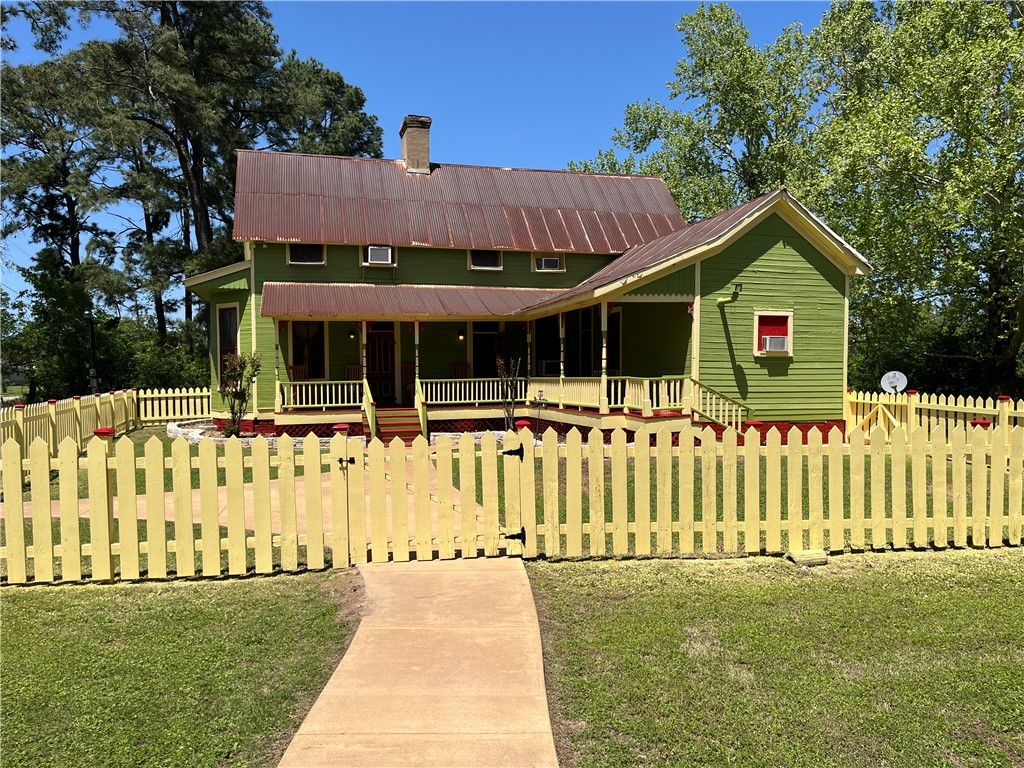 1100 Maple Calvert, TX 77837 - Photo 2 of 31 Front view of home featuring porch, front lawn, an