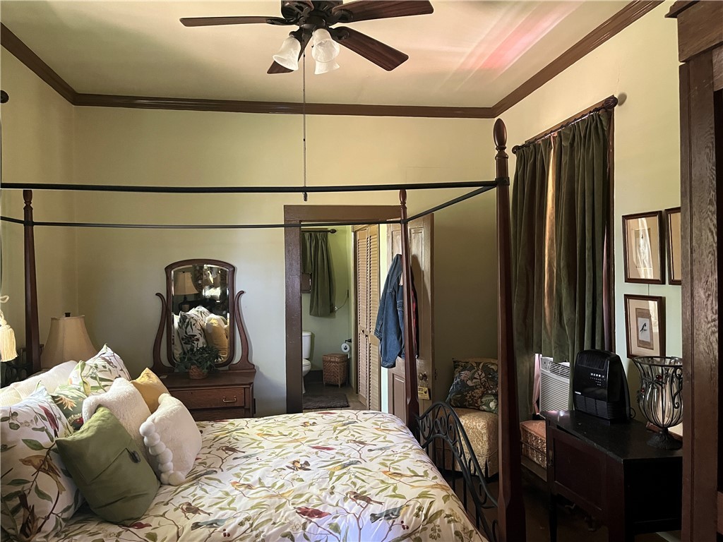 1100 Maple Calvert, TX 77837 - Photo 22 of 31 Lower floor bedroom, featuring ornamental molding