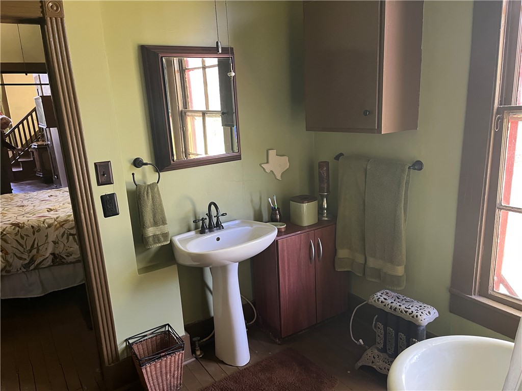 1100 Maple Calvert, TX 77837 - Photo 23 of 31 Bathroom and wood finished floors