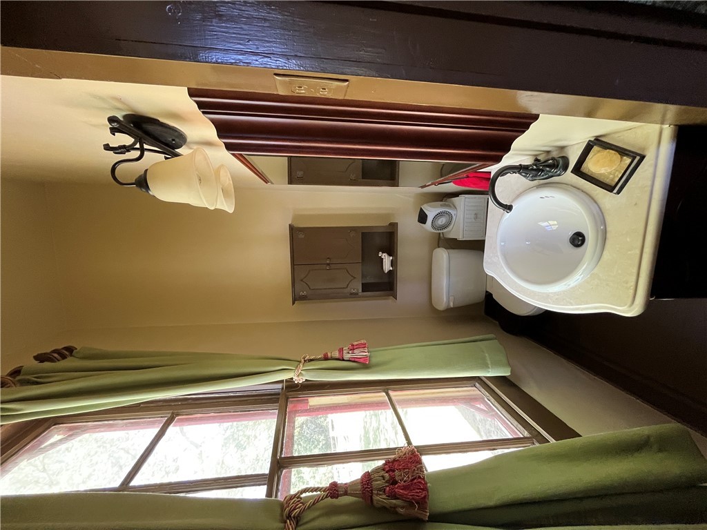 1100 Maple Calvert, TX 77837 - Photo 25 of 31 Bathroom featuring toilet and vanity