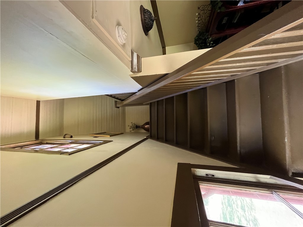 1100 Maple Calvert, TX 77837 - Photo 27 of 31 Staircase featuring a high ceiling