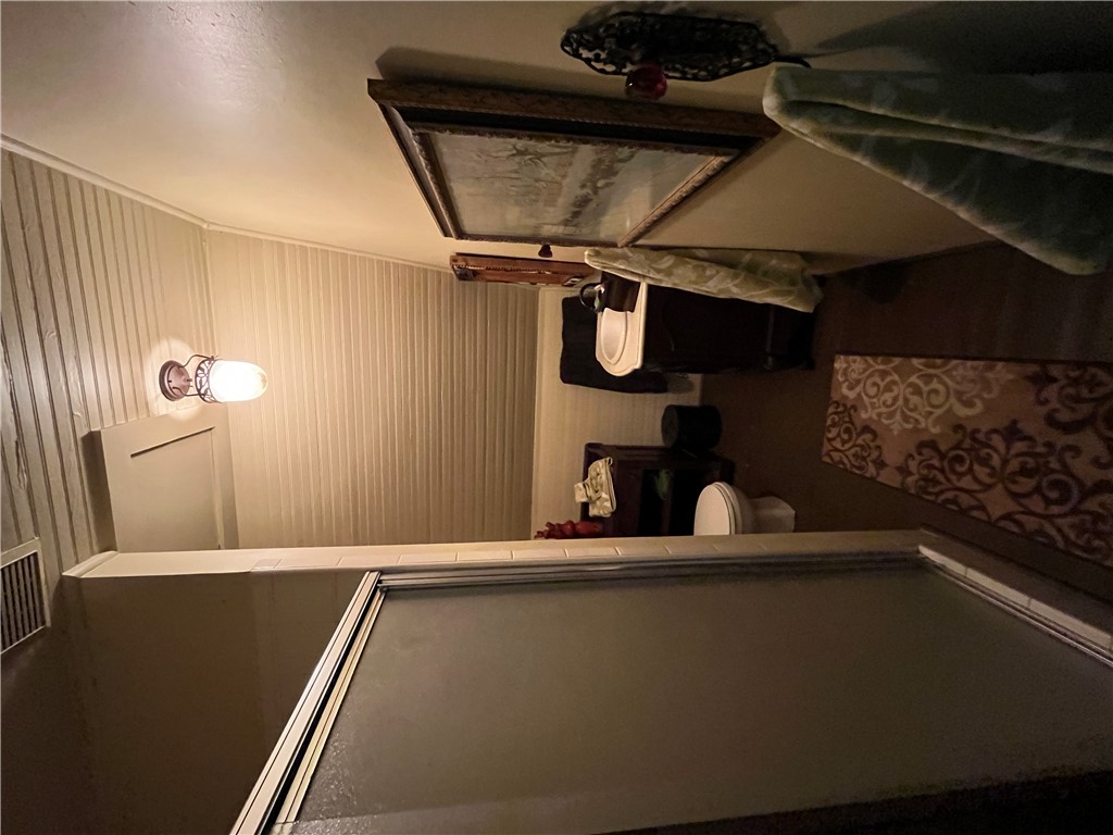 1100 Maple Calvert, TX 77837 - Photo 28 of 31 Full bathroom featuring a shower stall, wood ceiling, visible vents, and toilet