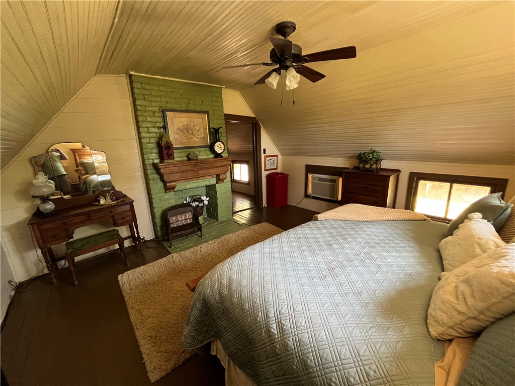 1100 Maple Calvert, TX 77837 - Photo 30 of 31 Bedroom with wooden ceiling, wood finished floors, and vaulted ceiling