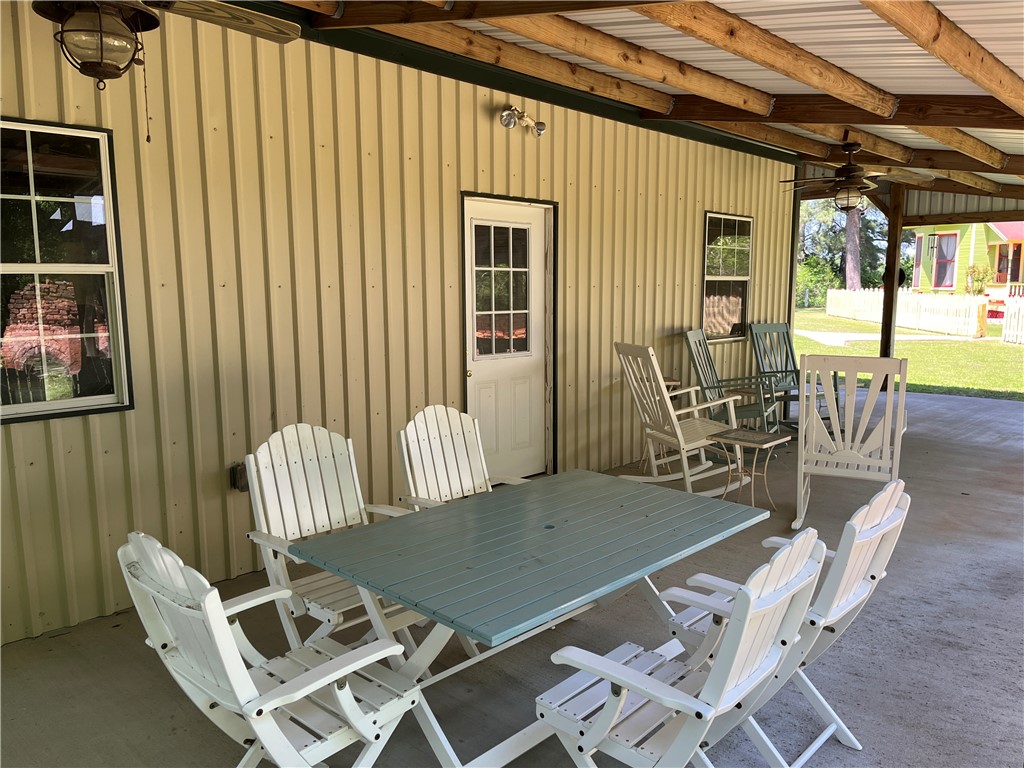 1100 Maple Calvert, TX 77837 - Photo 9 of 31 Patio beside carport, plenty of room for outdoor dining