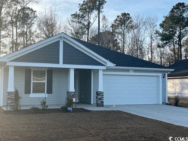 1130 Cherrystone Loop Conway, SC 29526 - Photo 1 of 38 Craftsman-style home with covered porch and a gara