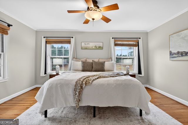 a bed room with a bed and a window