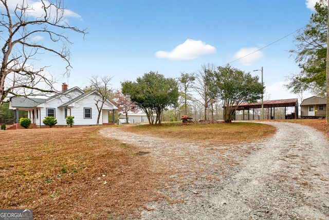 view of a house with a yard