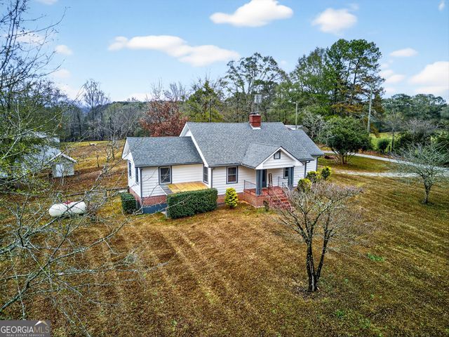a aerial view of a house with a yard