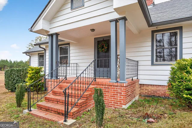 front view of a house with a bench