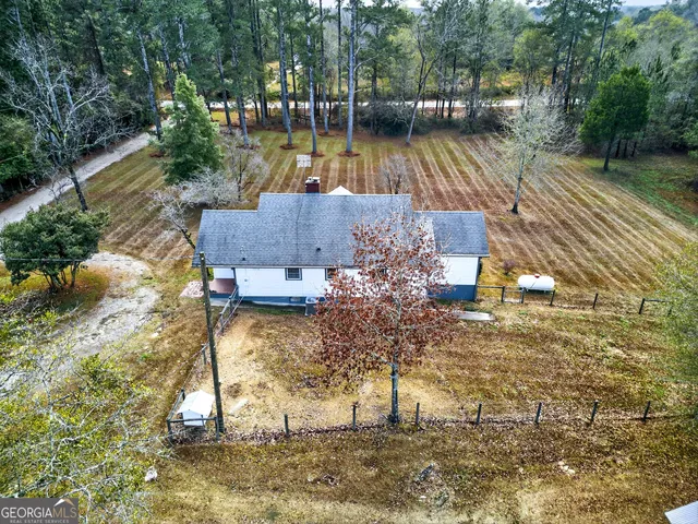 a backyard of a house with lots of green space