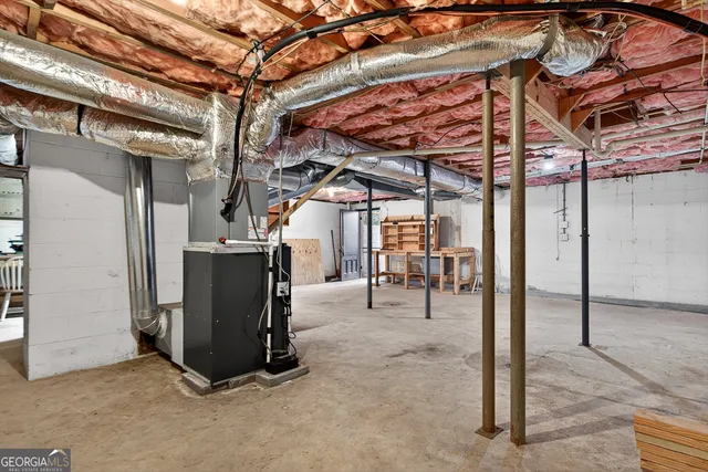 a front view of a house with a yard and potted plants