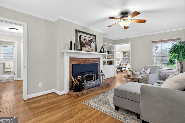 a living room with furniture and a fireplace