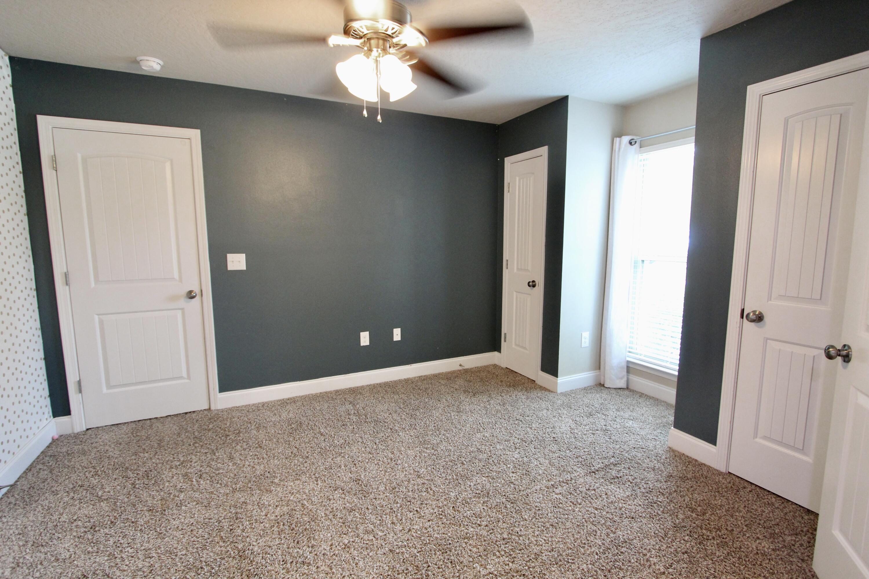4641 Chanan Drive Crestview, FL 32539 - Photo 14 of 45 an empty room with closet and a chandelier fan