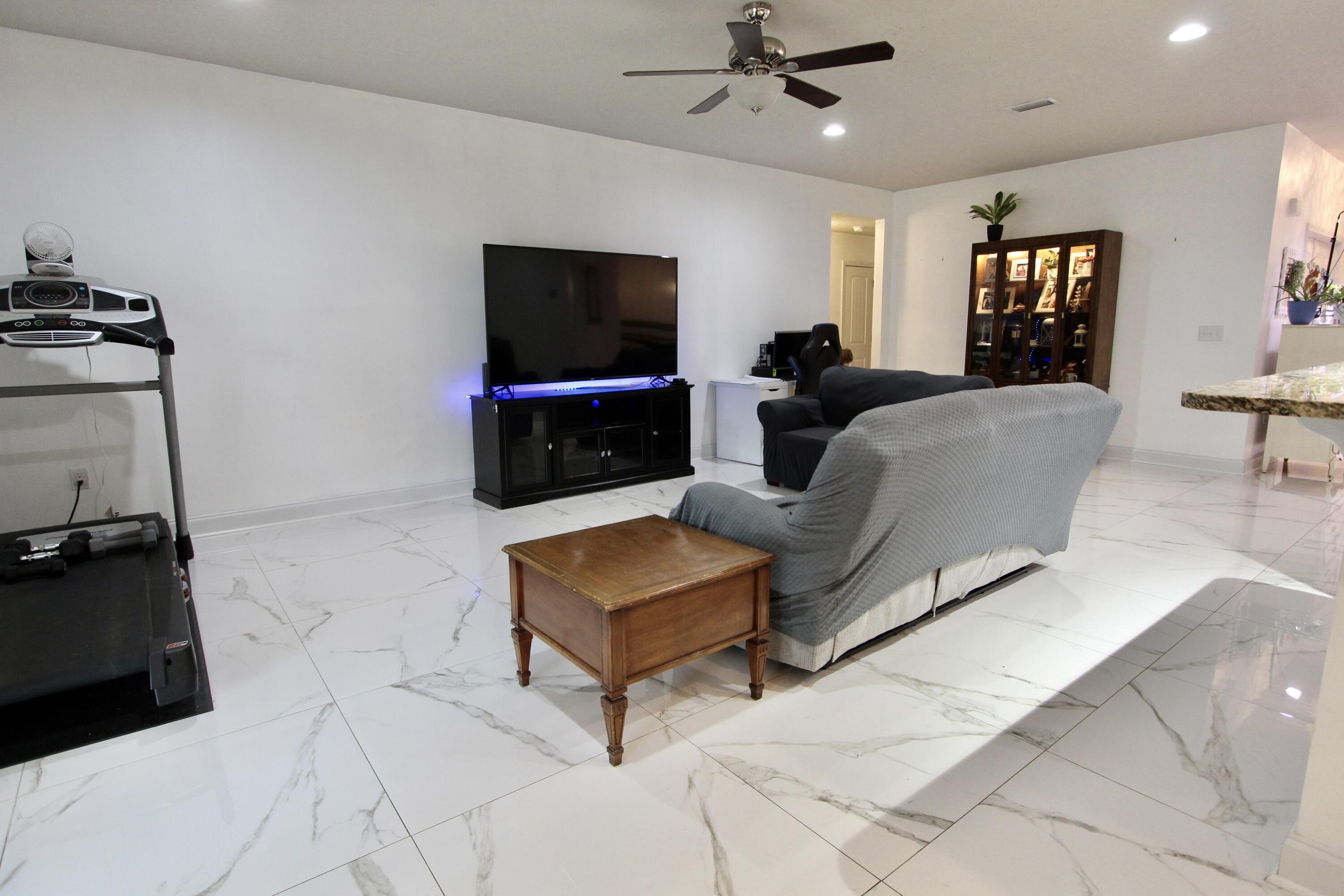 4641 Chanan Drive Crestview, FL 32539 - Photo 17 of 45 a living room with furniture and a flat screen tv