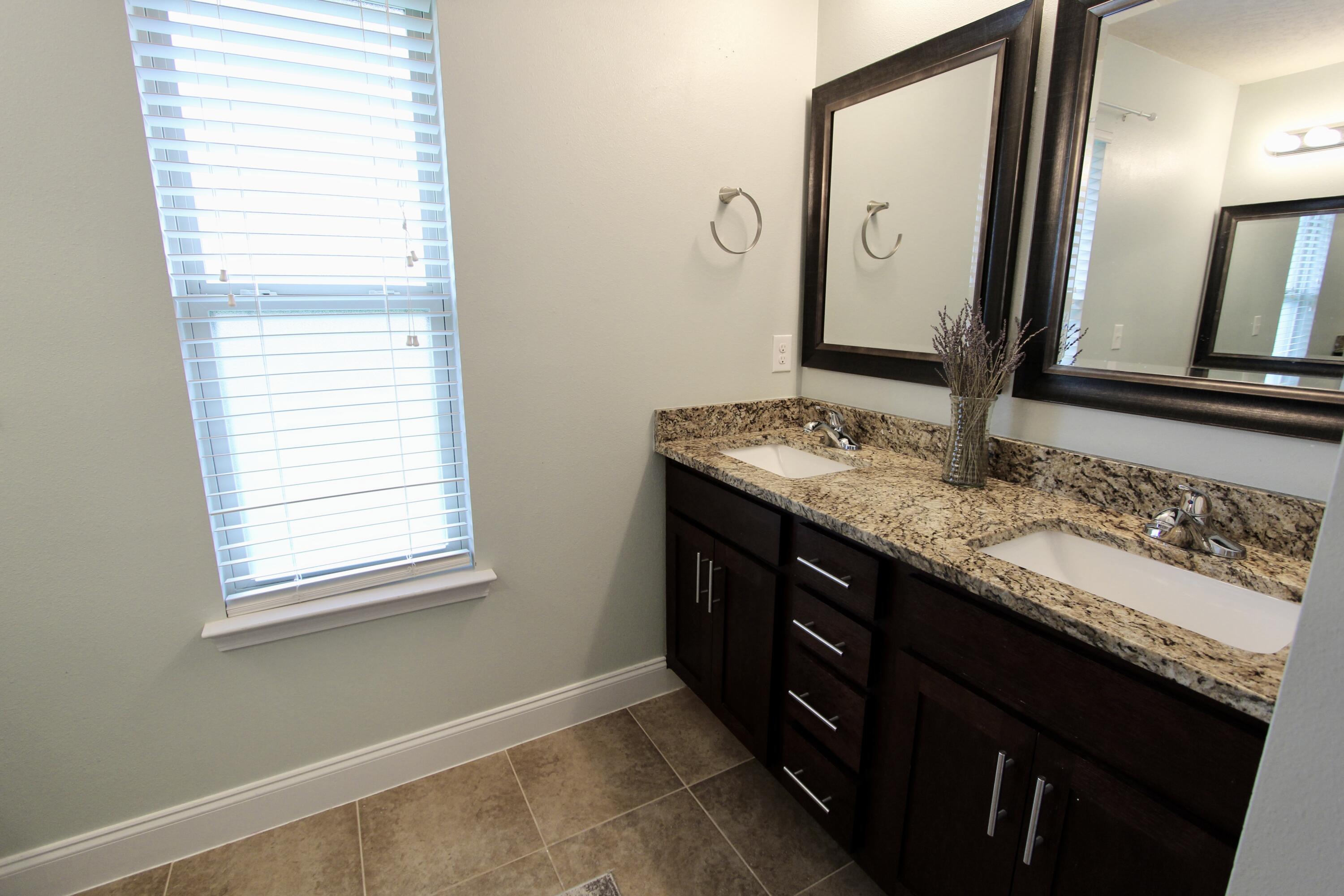 4641 Chanan Drive Crestview, FL 32539 - Photo 20 of 45 a bathroom with a sink and a mirror
