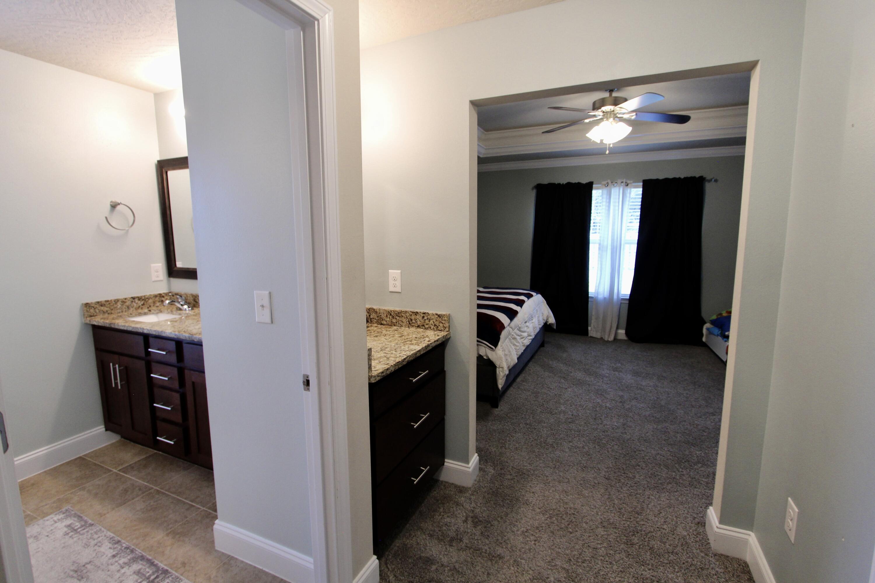 4641 Chanan Drive Crestview, FL 32539 - Photo 27 of 45 a view of hallway with washer and dryer