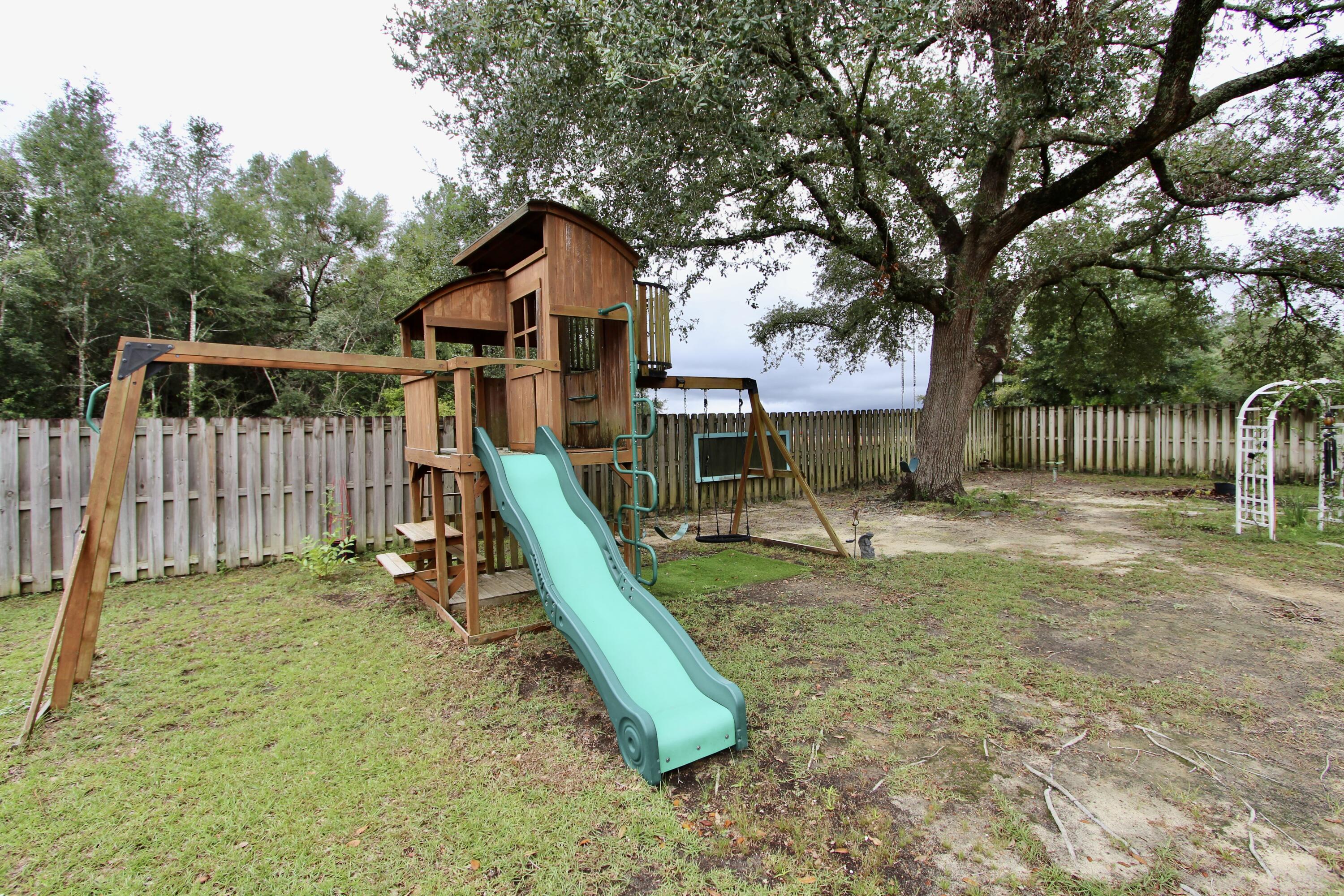 4641 Chanan Drive Crestview, FL 32539 - Photo 42 of 45 a view of a park with slide