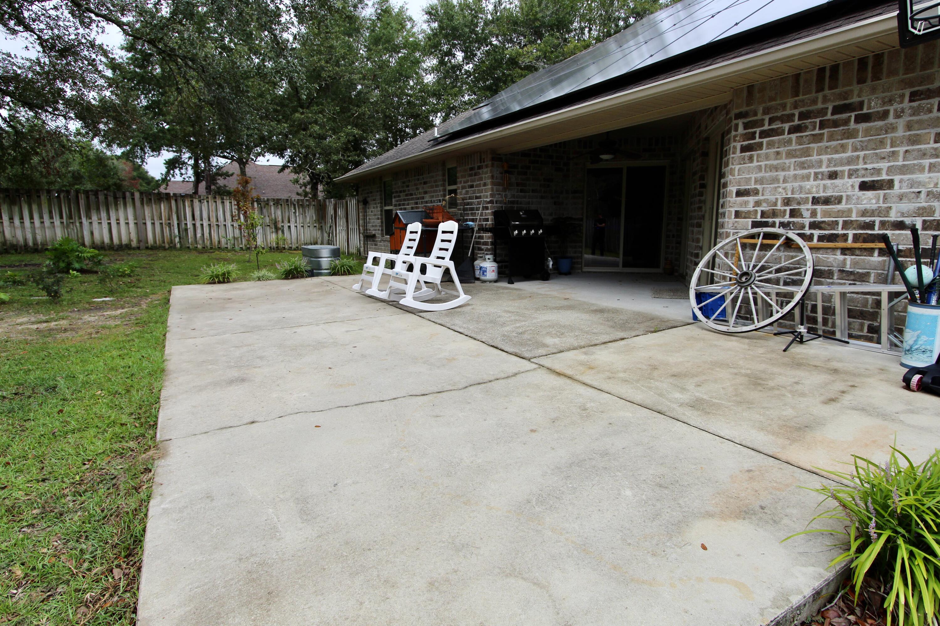 4641 Chanan Drive Crestview, FL 32539 - Photo 44 of 45 a view of a garage with parked cars