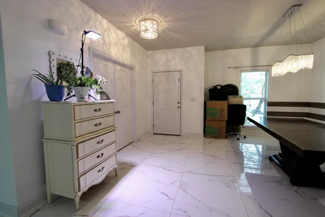 a kitchen with a refrigerator and cabinets