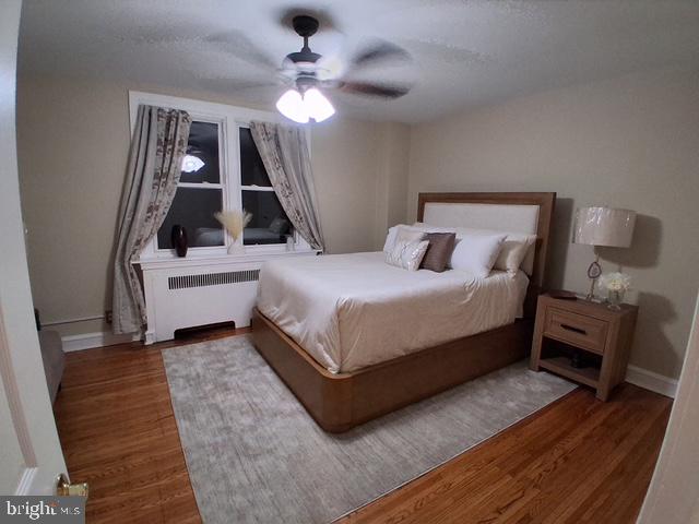 7975 Provident Street Philadelphia, PA 19150 - Photo 16 of 23 a bedroom with a bed wooden floor and window