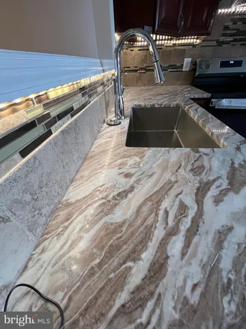 a kitchen with a stove and a sink