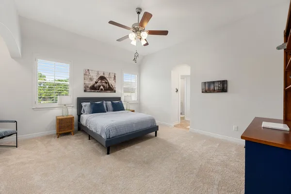 a bedroom with a bed and dresser