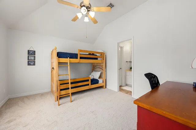 a en suite bathroom with a sink and a mirror